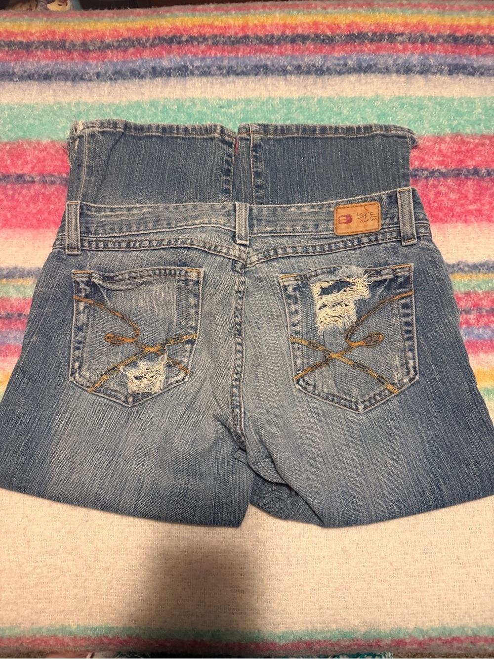 Distressed Light Wash Denim capris with Embroidered Pockets